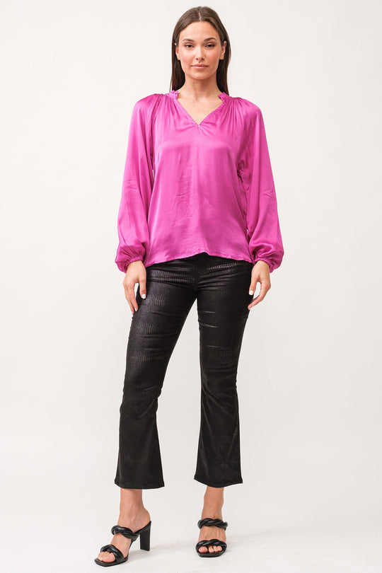 image of a female model wearing a MANON V-NECK LONG SLEEVE TOP DAHILA MAUVE DEAR JOHN DENIM 