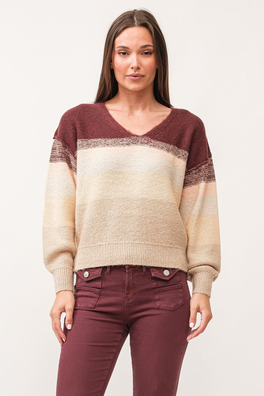 image of a female model wearing a LEXI V-NECK LONG SLEEVE RELAXED FIT SWEATER HOLIDAY MIMOSA DEAR JOHN DENIM 