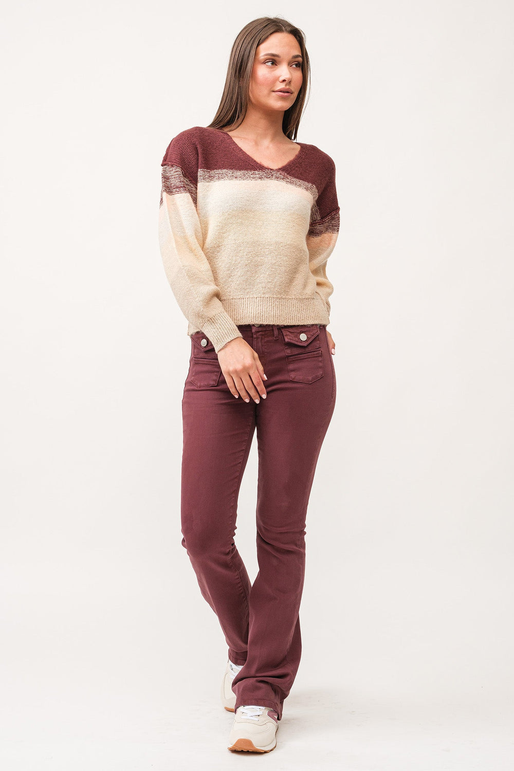 image of a female model wearing a LEXI V-NECK LONG SLEEVE RELAXED FIT SWEATER HOLIDAY MIMOSA DEAR JOHN DENIM 