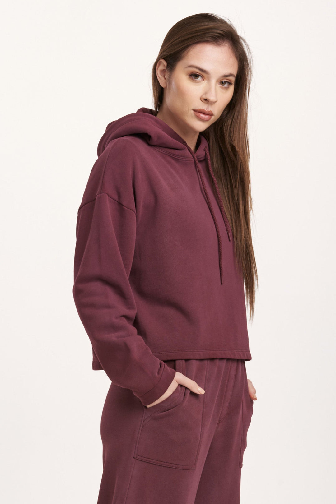 image of a female model wearing a PAXTON HOODIE SWEATSHIRT PLUM BERRY DEAR JOHN DENIM 