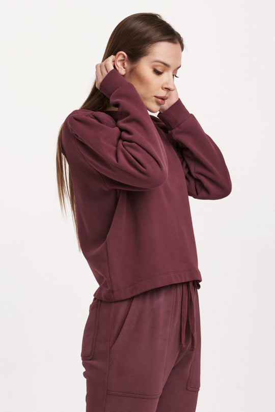 image of a female model wearing a RAYA SCOOP BACK SWEATSHIRT PLUM BERRY DEAR JOHN DENIM 