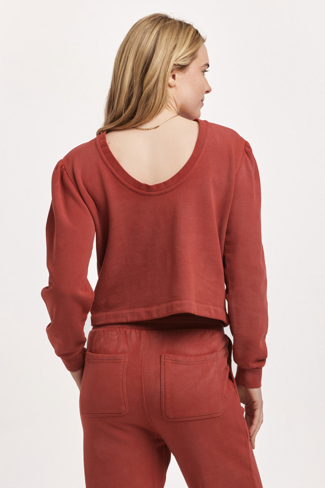 image of a female model wearing a RAYA SCOOP BACK SWEATSHIRT INTENSE RUST DEAR JOHN DENIM 