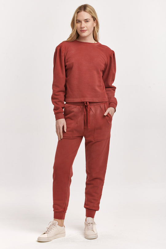 image of a female model wearing a RAYA SCOOP BACK SWEATSHIRT INTENSE RUST DEAR JOHN DENIM 