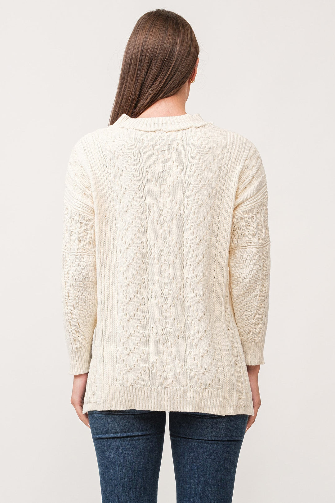 image of a female model wearing a THORA V-NECK LONG SLEEVE RELAXED FIT SWEATER ANTIQUE WHITE DEAR JOHN DENIM 