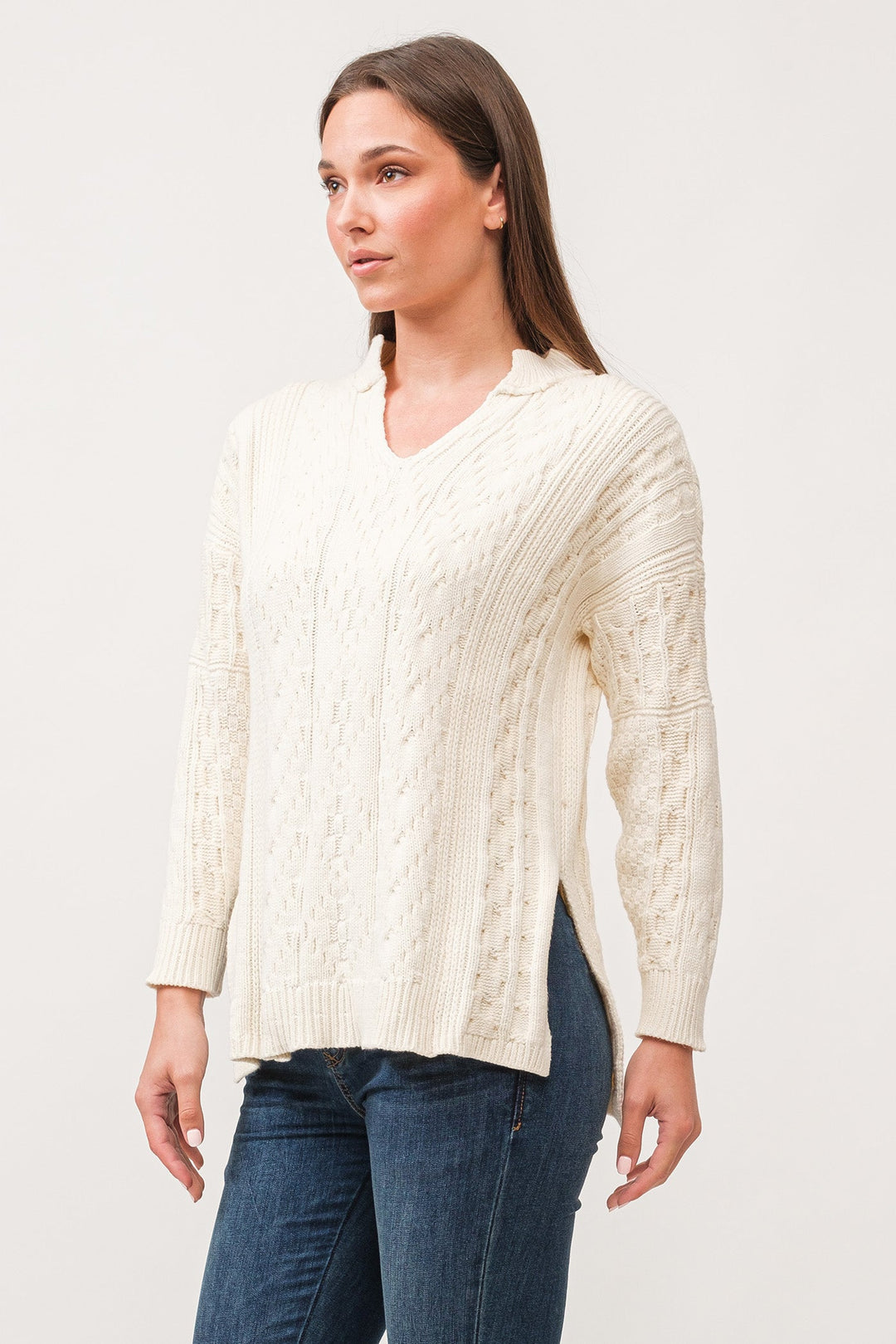 image of a female model wearing a THORA V-NECK LONG SLEEVE RELAXED FIT SWEATER ANTIQUE WHITE DEAR JOHN DENIM 