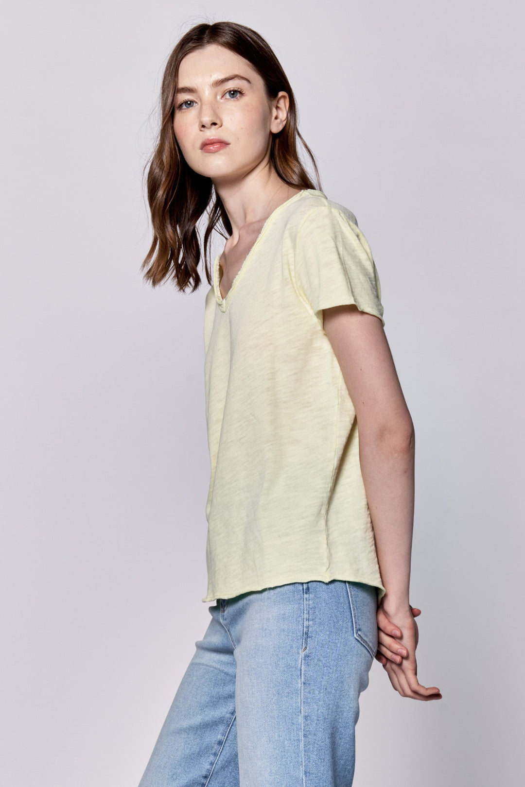 image of a female model wearing a VANYA V-NECK SHORT SLEEVE SLUB JERSEY TOP PALE LIME YELLOW DEAR JOHN DENIM 