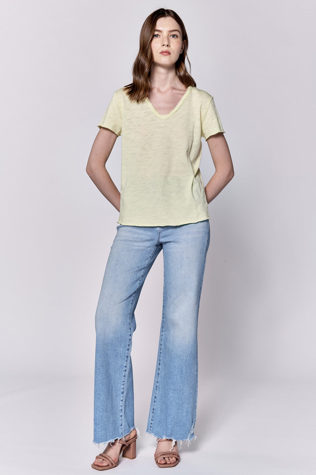 image of a female model wearing a VANYA V-NECK SHORT SLEEVE SLUB JERSEY TOP PALE LIME YELLOW DEAR JOHN DENIM 