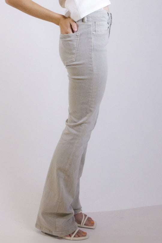 image of a female model wearing a JAXTYN HIGH RISE BOOTCUT JEANS OYSTER GRAY DEAR JOHN DENIM 