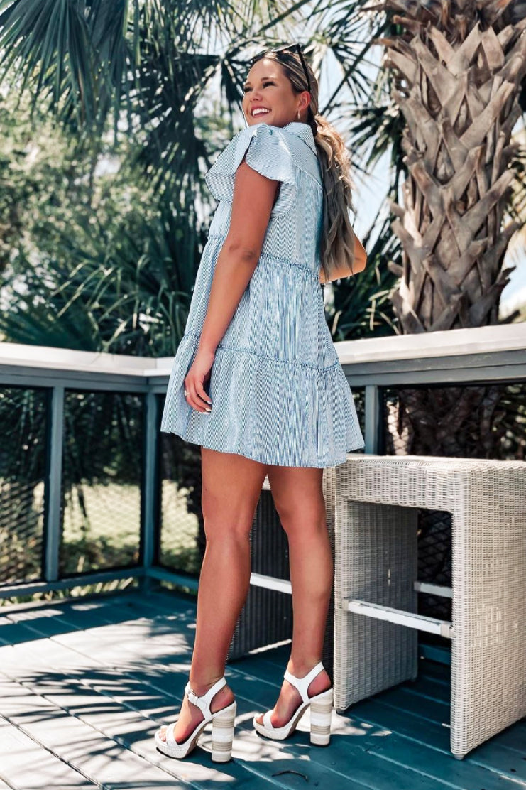 image of a female model wearing a LILI DRESS IN OUTDOOR NAVY WHITE DRESSES