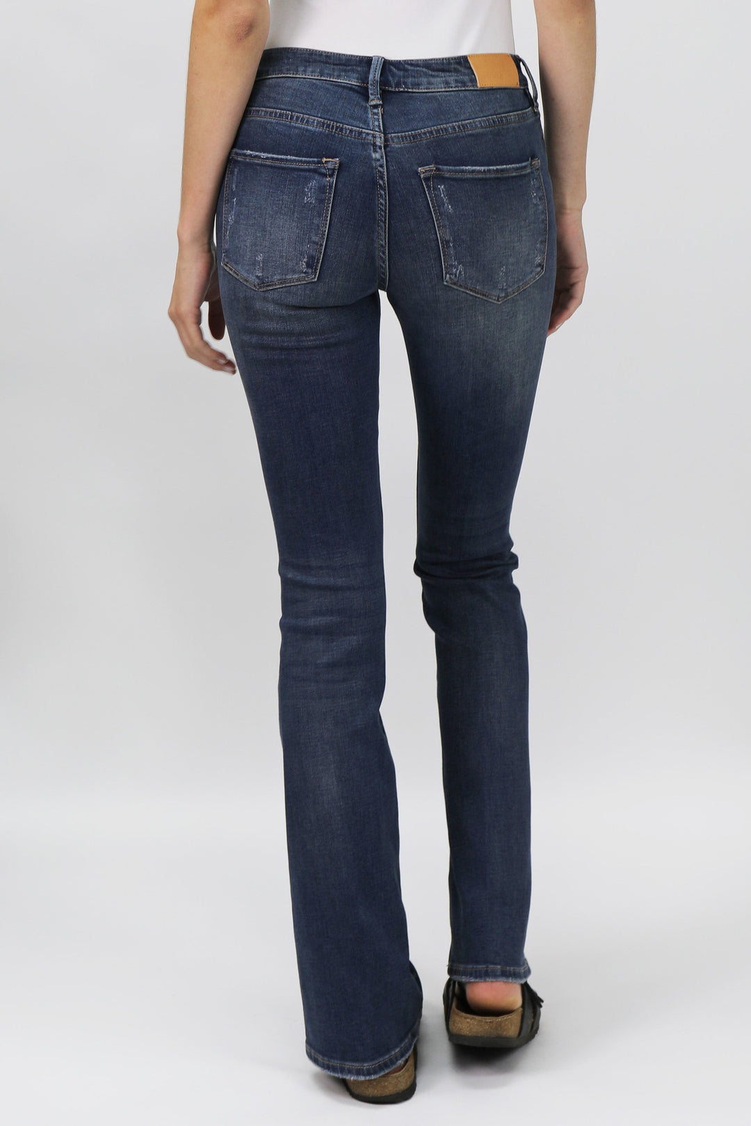 image of a female model wearing a jaxtyn high rise bootcut jeans millbridge JEANS
