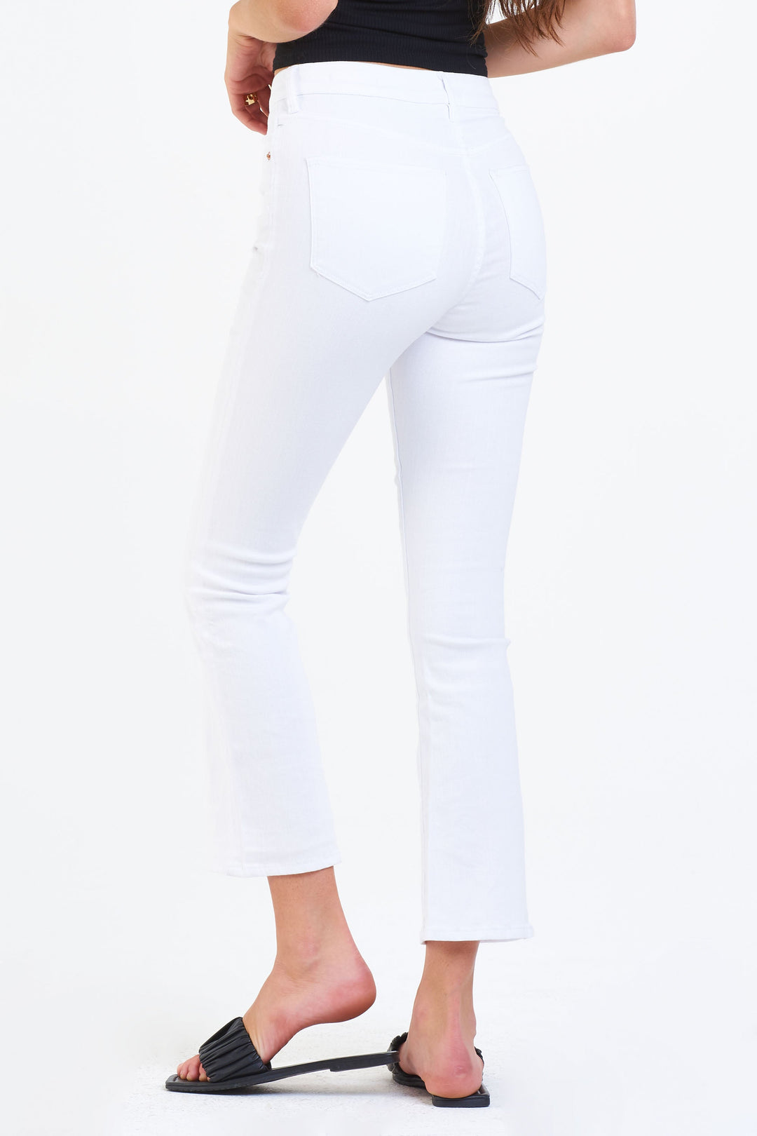 image of a female model wearing a JEANNE SUPER HIGH RISE CROPPED FLARE LEG JEANS OPTIC WHITE JEANS