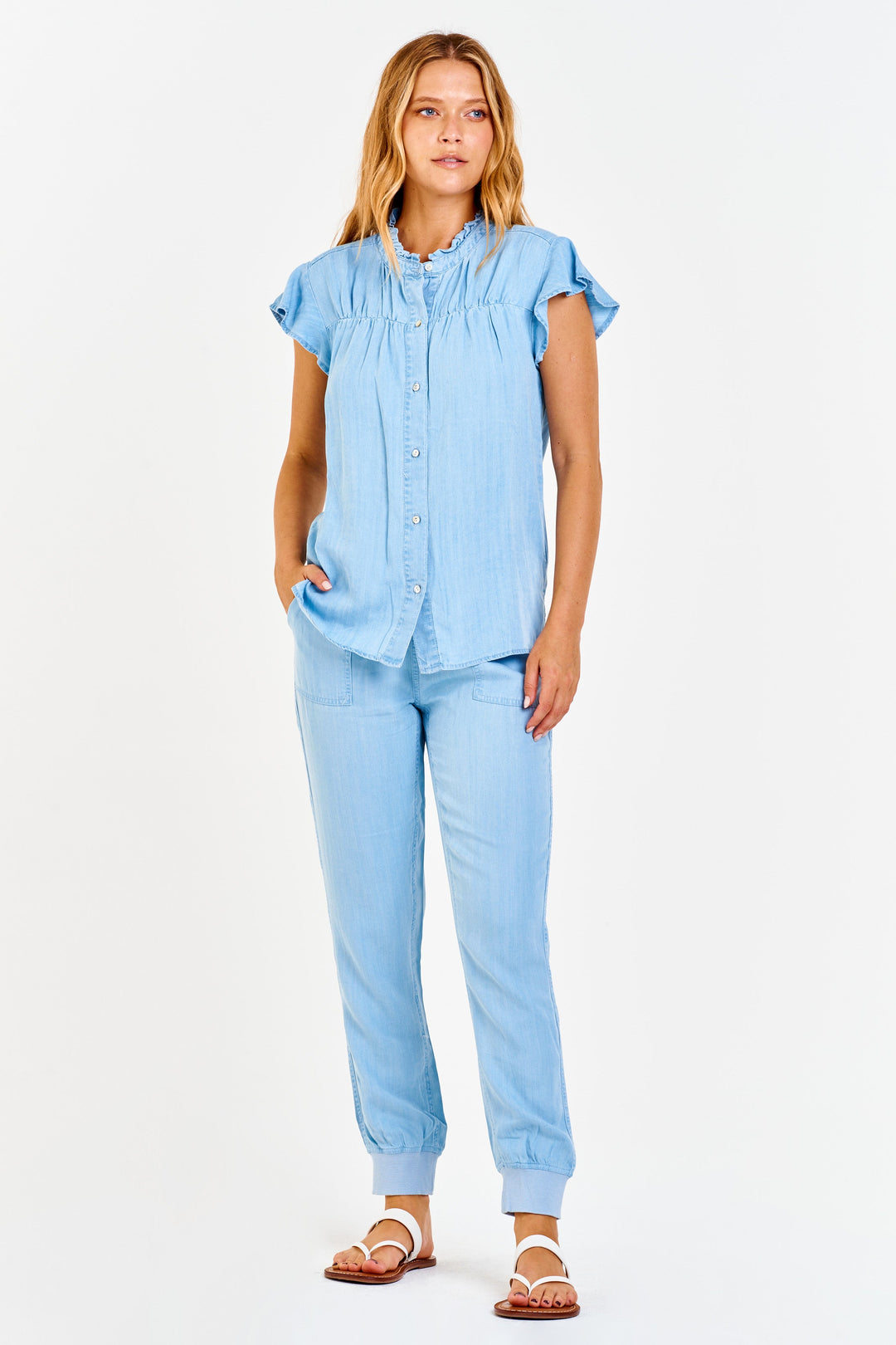image of a female model wearing a JACEY SUPER HIGH RISE CROPPED JOGGER PANTS PERFECT BLUE PANTS