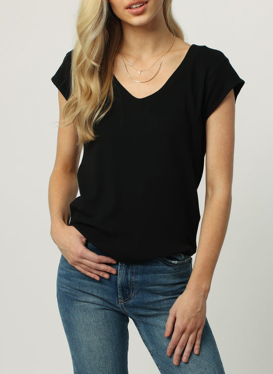 image of a female model wearing a URI THERMAL V-NECK TOP BLACK DEAR JOHN DENIM 