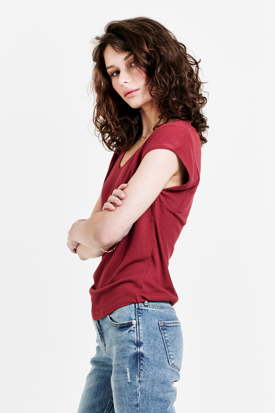 image of a female model wearing a URI THERMAL V-NECK TOP GOJI BERRY TOPS