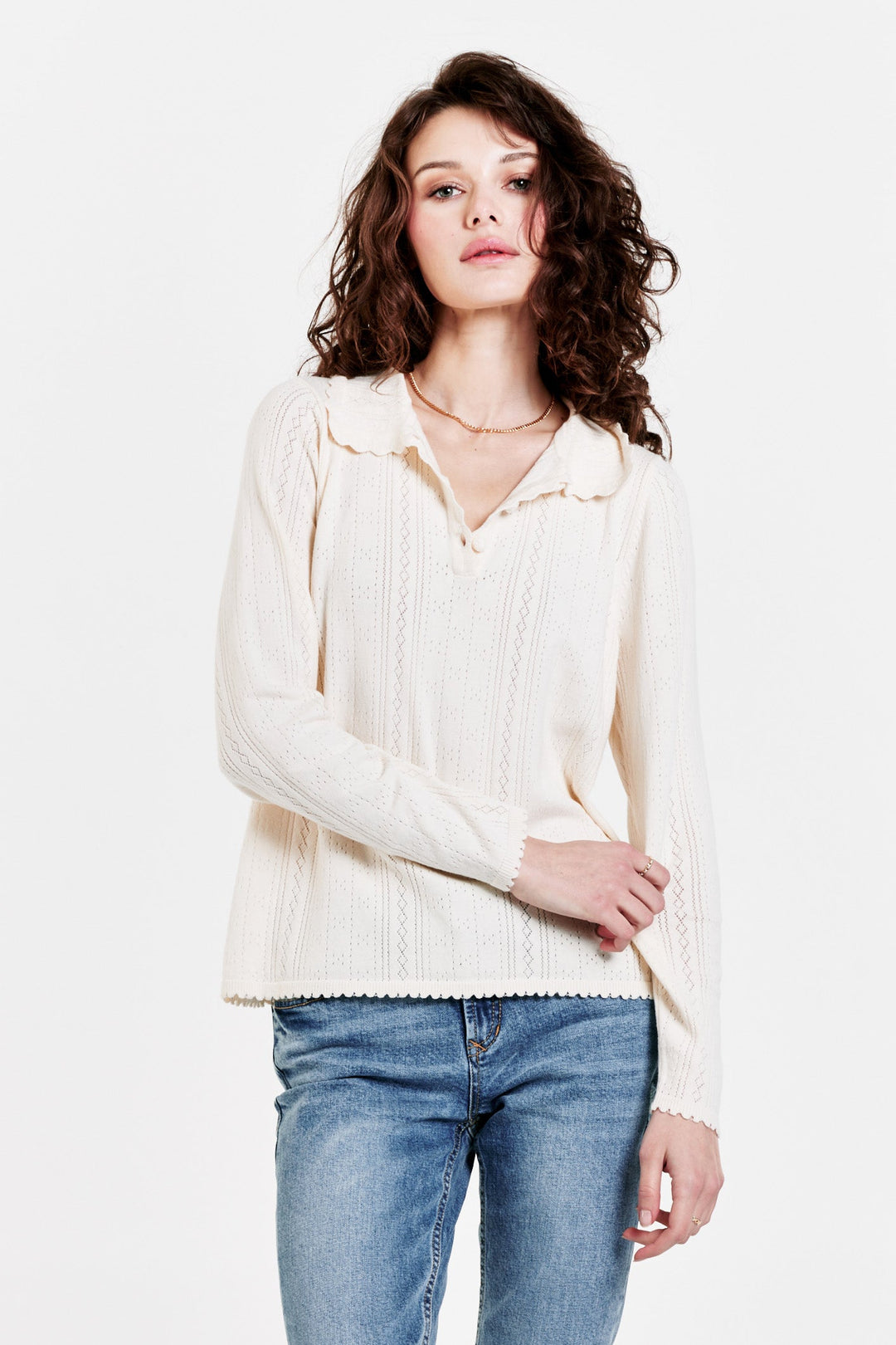 image of a female model wearing a ELIZABETH BUTTON FRONT HENLEY CREAM TOPS