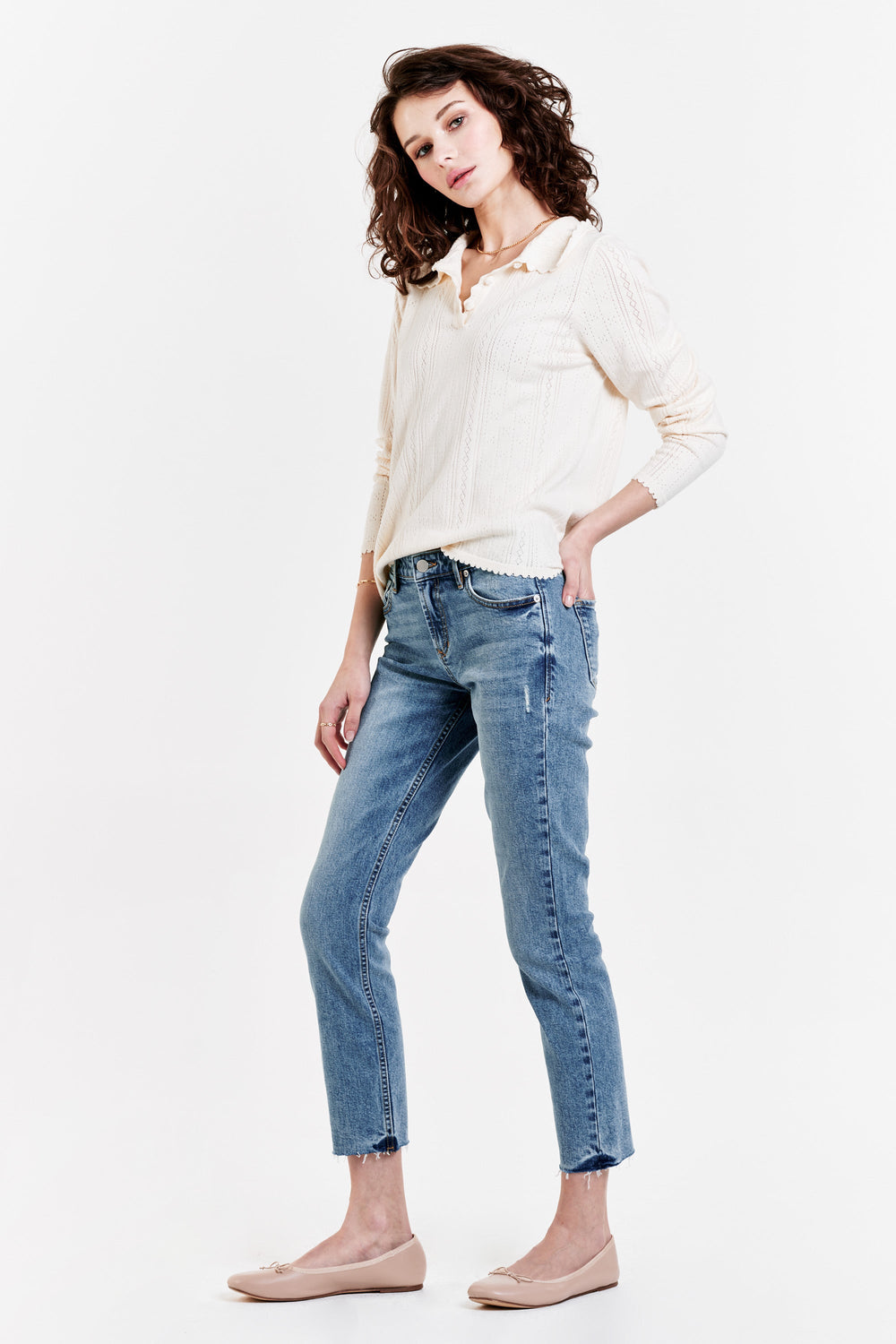 image of a female model wearing a ELIZABETH BUTTON FRONT HENLEY CREAM TOPS
