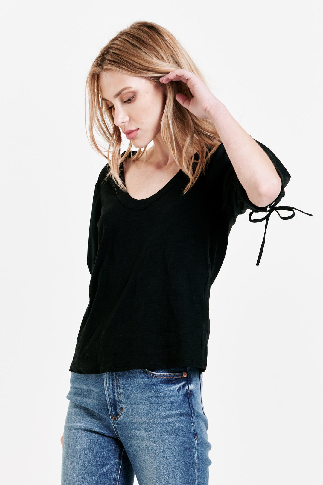 image of a female model wearing a GRACELYN TIE CUFF TOP BLACK DEAR JOHN DENIM 