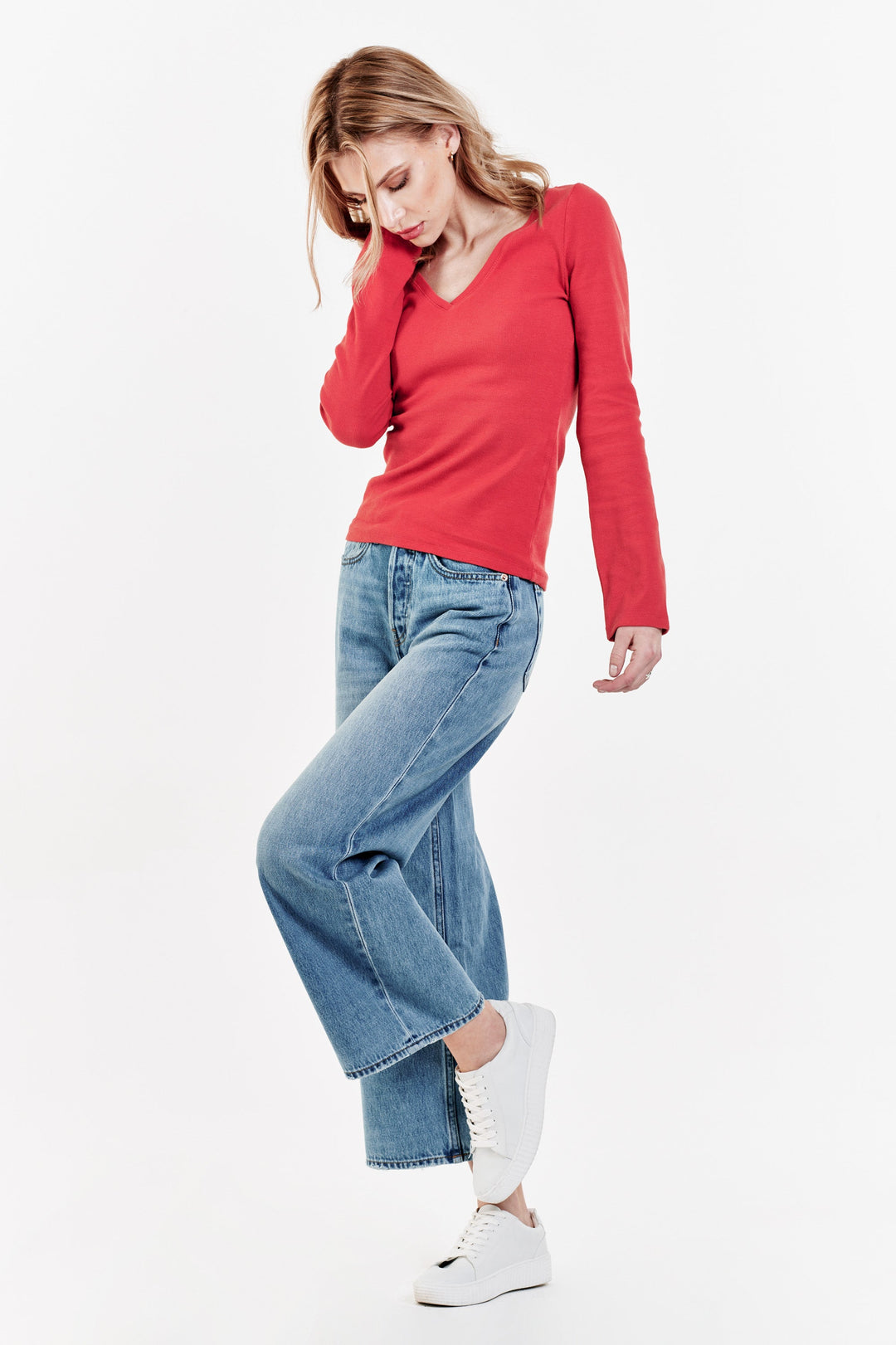 image of a female model wearing a SCARLETT V-NECK TOP PERSIMMON TOPS