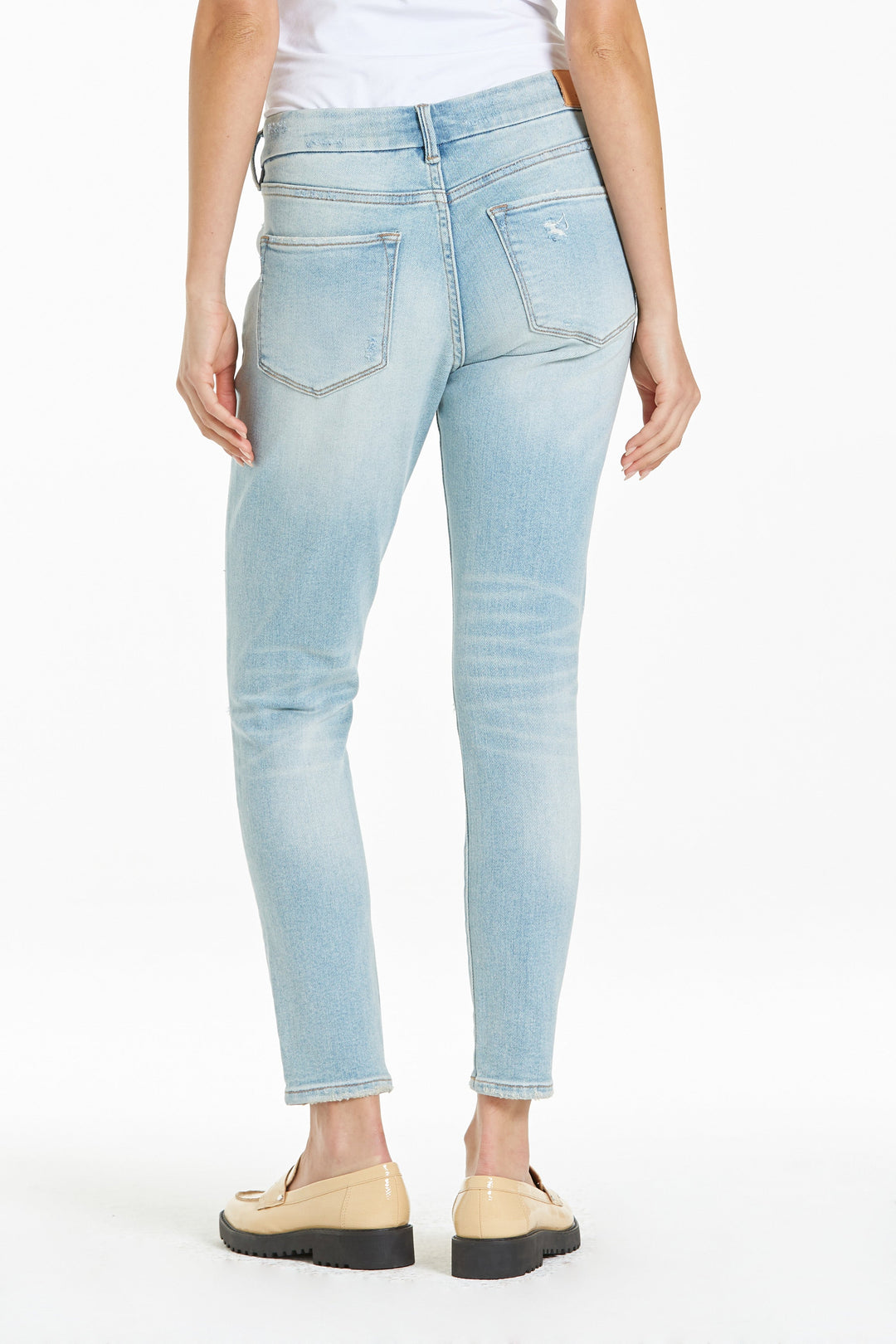 image of a female model wearing a JOYRICH MID RISE ANKLE SKINNY JEANS BELLE ISLE JEANS