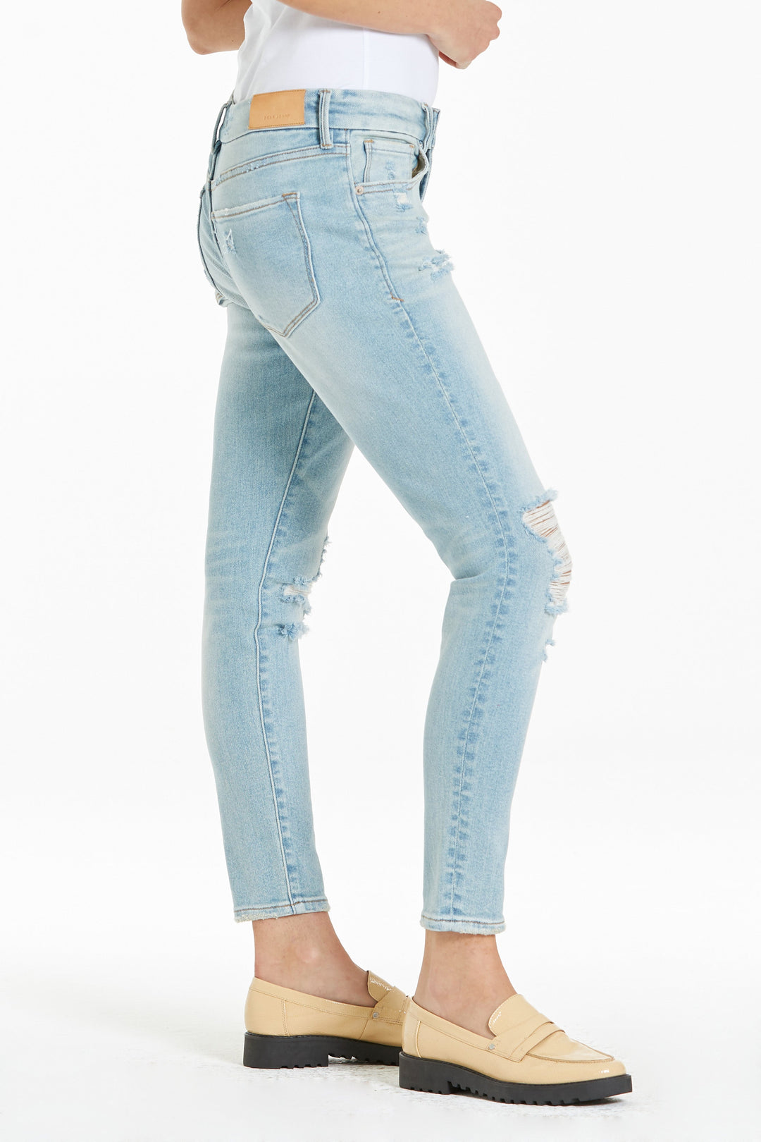 image of a female model wearing a JOYRICH MID RISE ANKLE SKINNY JEANS BELLE ISLE JEANS