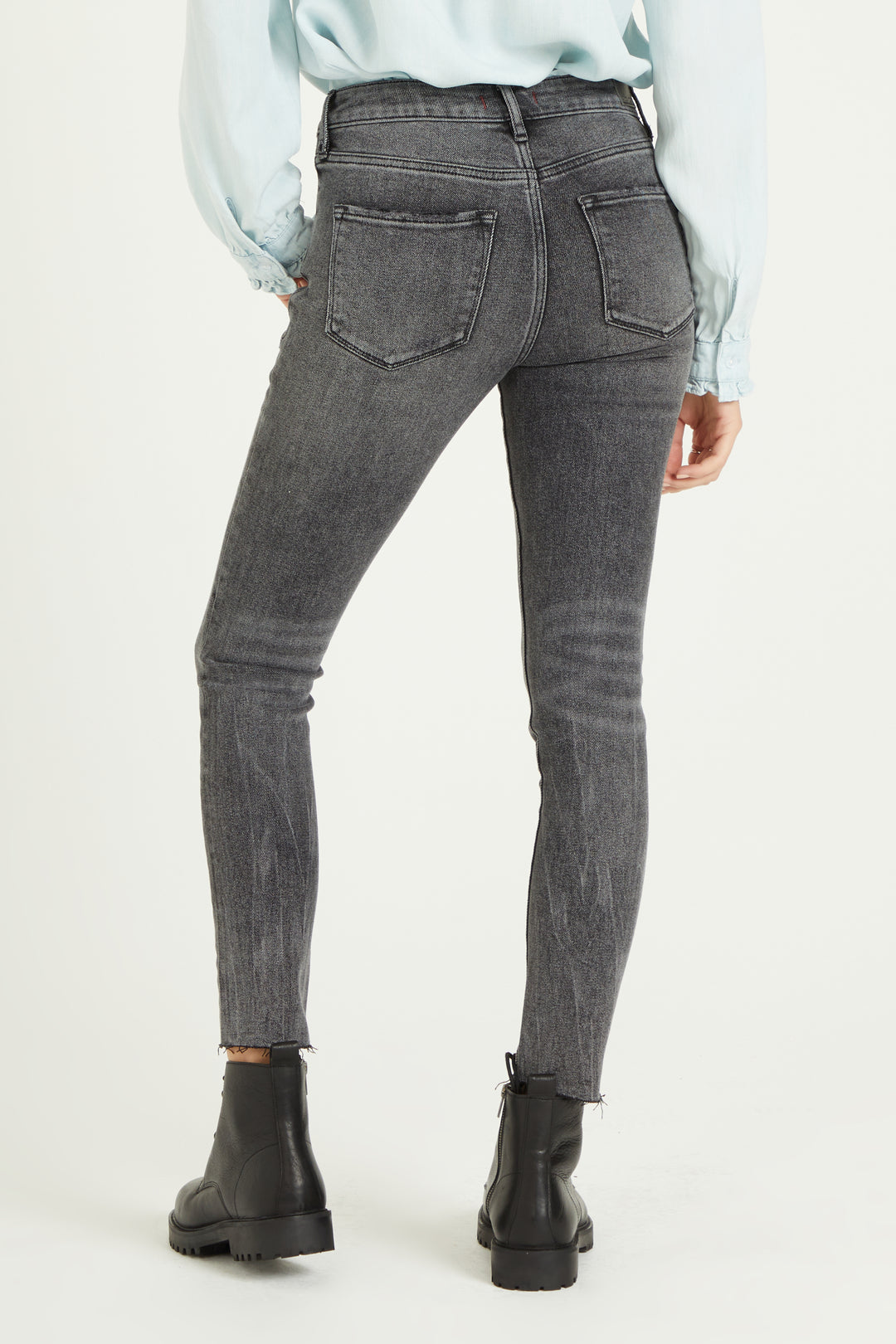 image of a female model wearing a 9 1/2" HIGH RISE GISELE SKINNY IN QUEBEC DEAR JOHN DENIM 