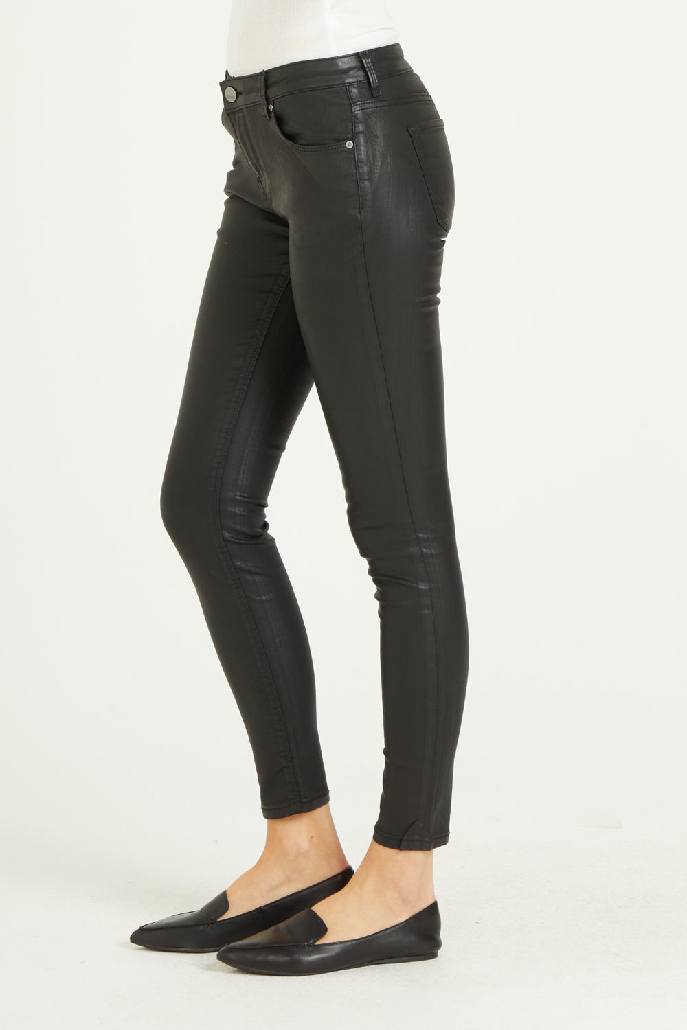 image of a female model wearing a PIXIE HIGH RISE ANKLE SKINNY JEANS BLACK COATED JEANS