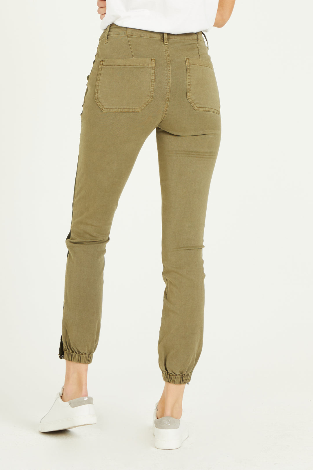 image of a female model wearing a 10" HIGH RISE JOURDAN JOGGER GREEN CYPRESS PANTS