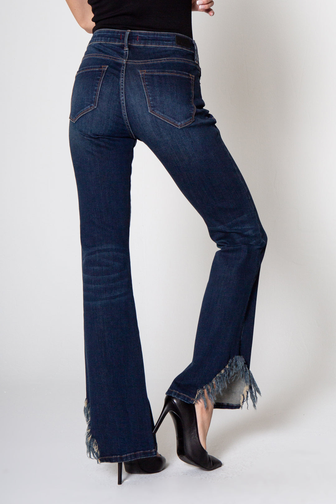 image of a female model wearing a 9 1/2" MID RISE ROSIE FLARE IN BIXBY DEAR JOHN DENIM 