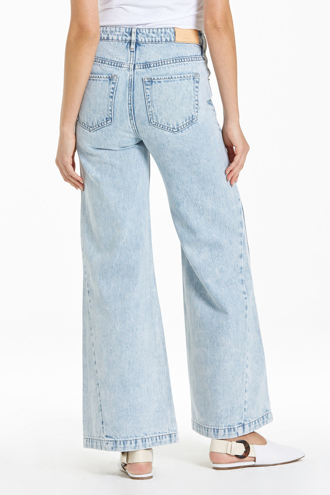 image of a female model wearing a ADDISON SUPER HIGH RISE WIDE LEG JEANS SHOAL BAY JEANS