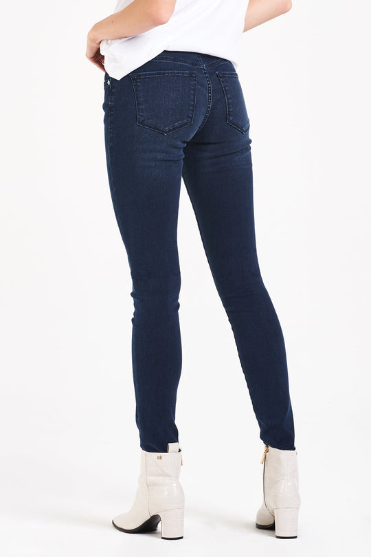 image of a female model wearing a JOYRICH MID RISE ANKLE SKINNY JEANS DECKER CANYON JEANS