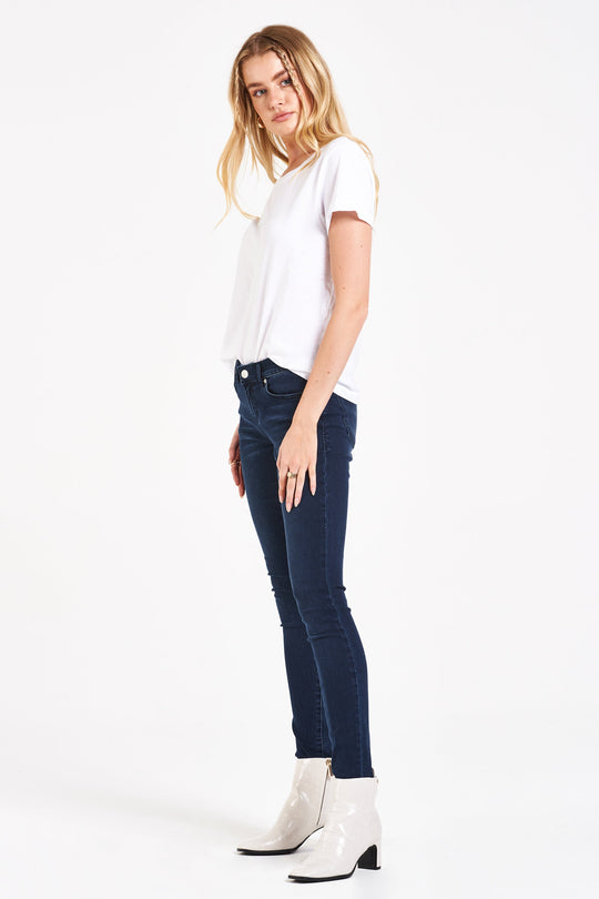 image of a female model wearing a JOYRICH MID RISE ANKLE SKINNY JEANS DECKER CANYON JEANS