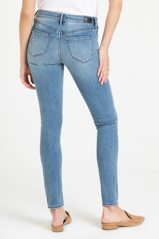 image of a female model wearing a JOYRICH MID RISE SKINNY JEANS PATHWAY JEANS