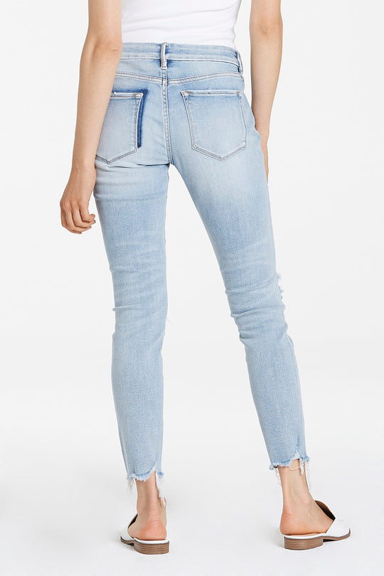 image of a female model wearing a JOYRICH MID RISE ANKLE SKINNY JEANS REEF BEACH JEANS