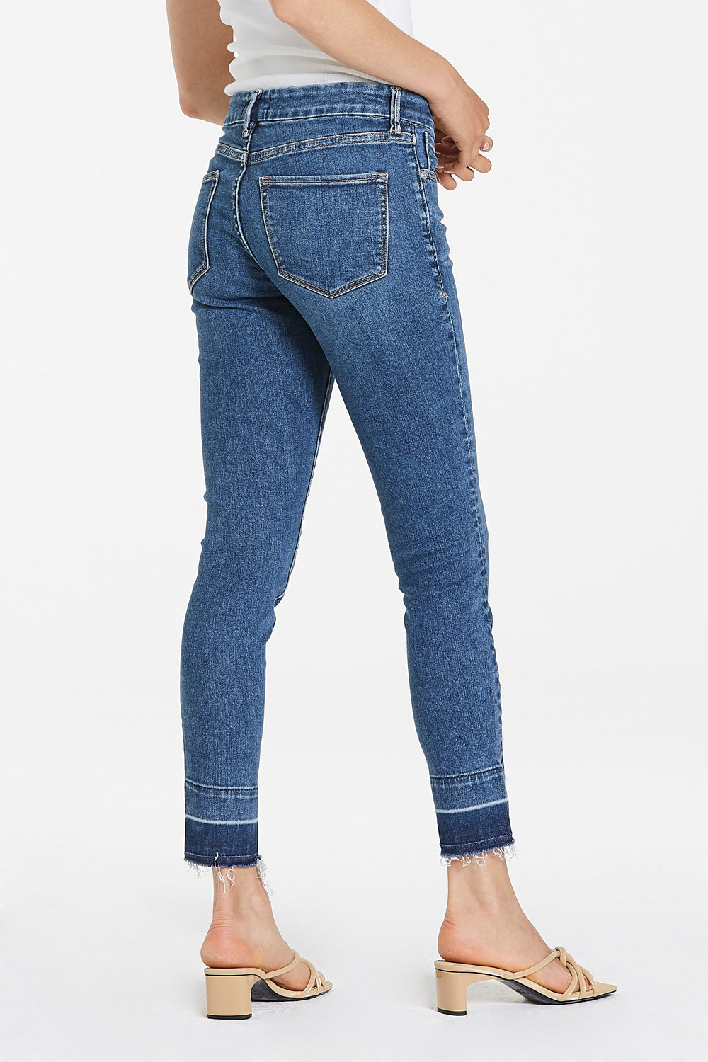 image of a female model wearing a JOYRICH MID RISE ANKLE SKINNY JEANS MALLORCA JEANS