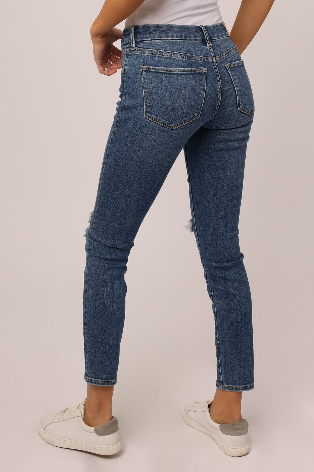 image of a female model wearing a JOYRICH MID RISE ANKLE SKINNY JEANS BENFIELD JEANS