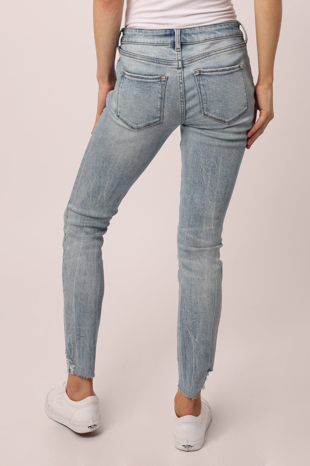 image of a female model wearing a JOYRICH MID RISE SKINNY JEANS ALAMOSA JEANS