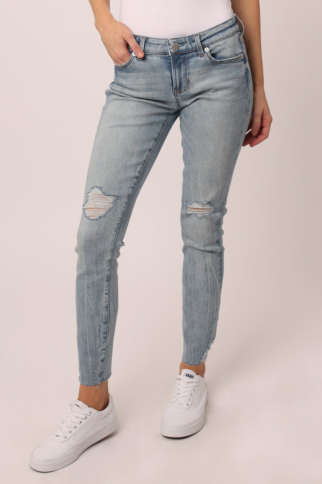 image of a female model wearing a JOYRICH MID RISE SKINNY JEANS ALAMOSA JEANS