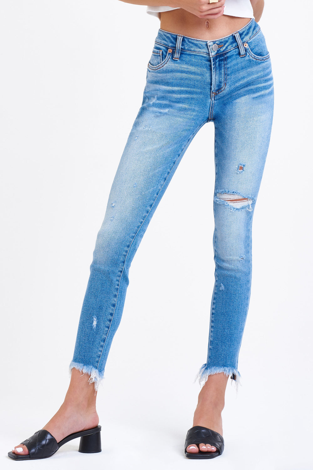 image of a female model wearing a JOYRICH MID RISE ANKLE SKINNY JEANS WALL STREET JEANS