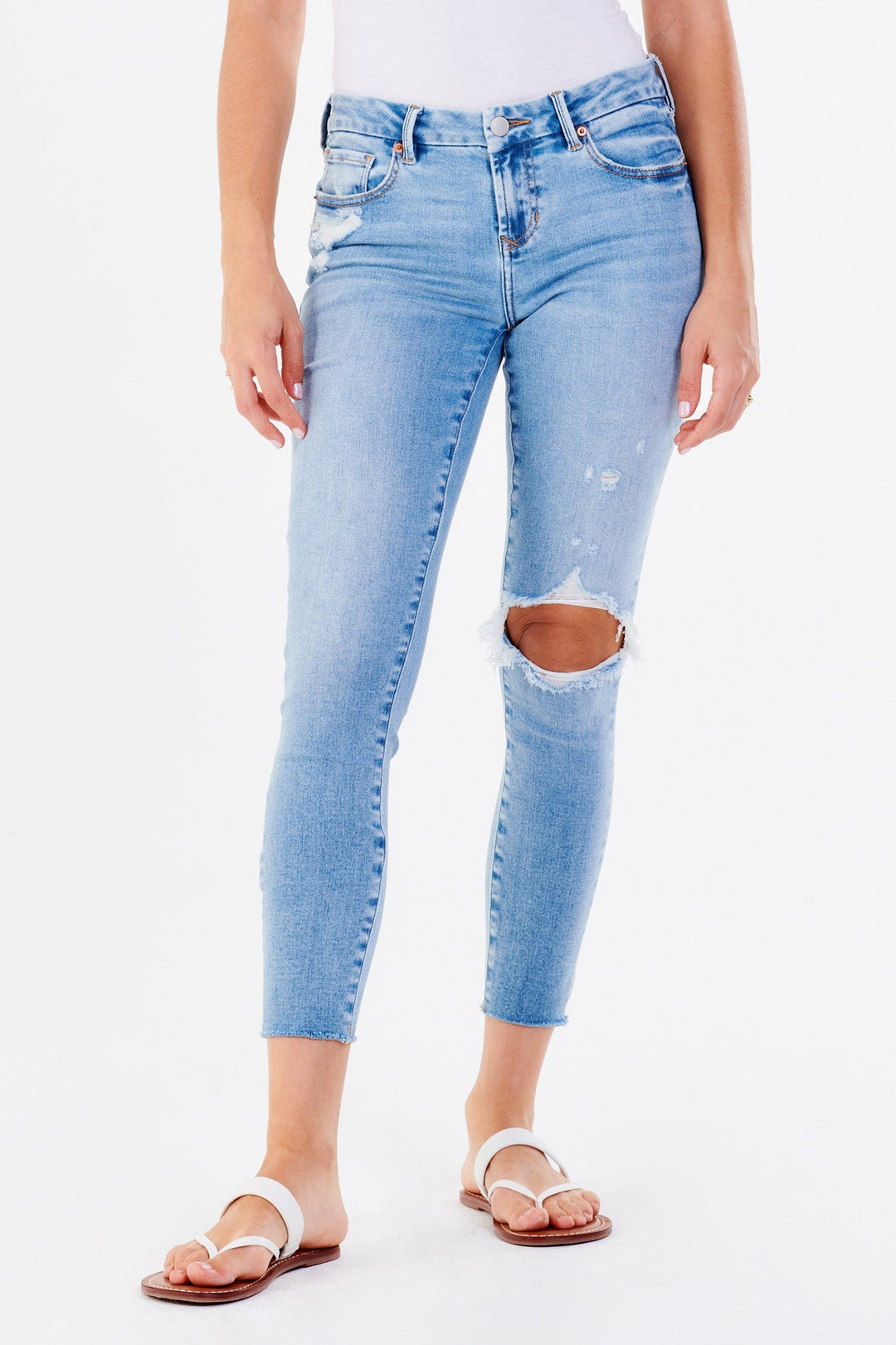image of a female model wearing a JOYRICH MID RISE ANKLE SKINNY JEANS ORINDA JEANS