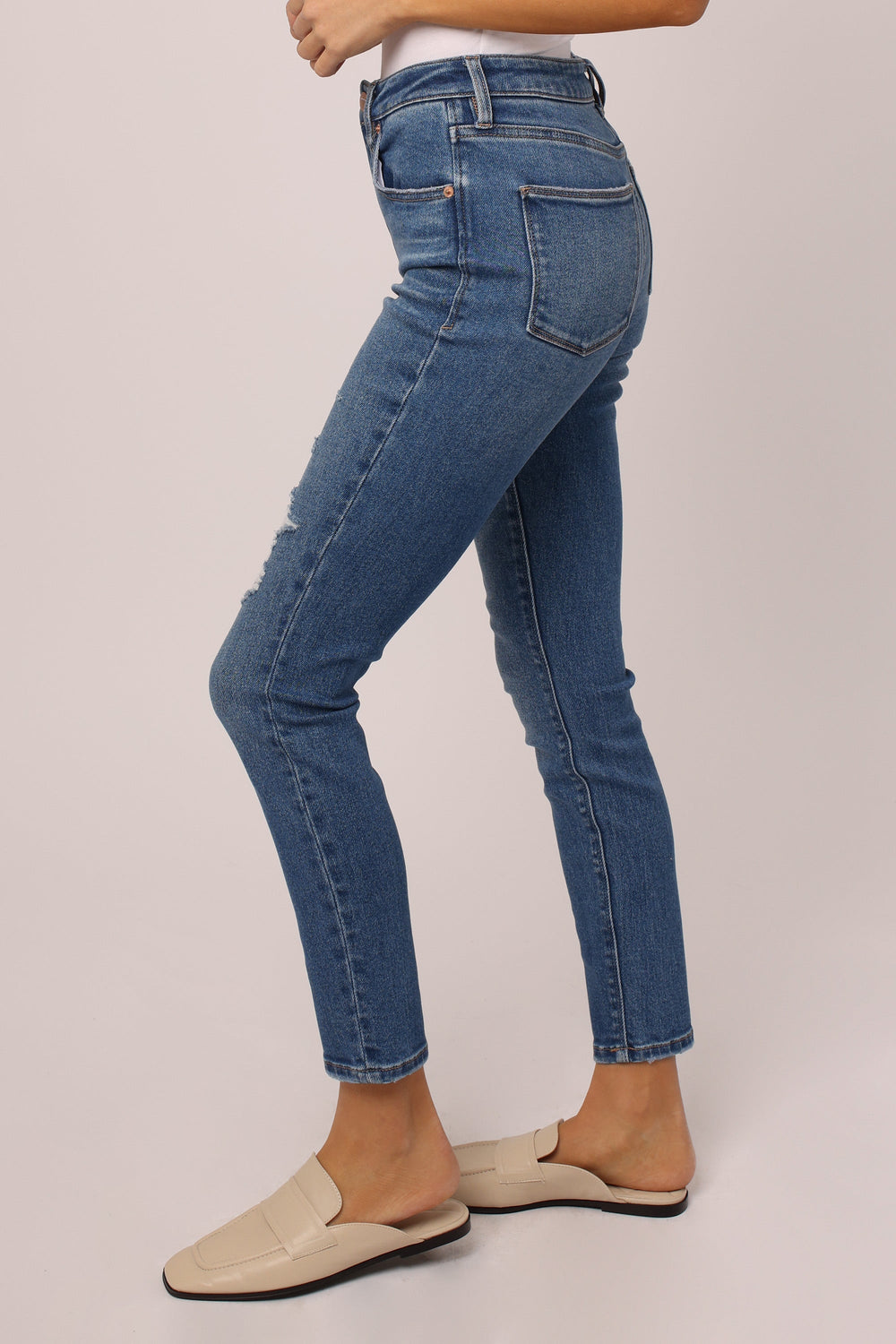 image of a female model wearing a OLIVIA SUPER HIGH RISE ANKLE SKINNY JEANS PATAGONIA JEANS