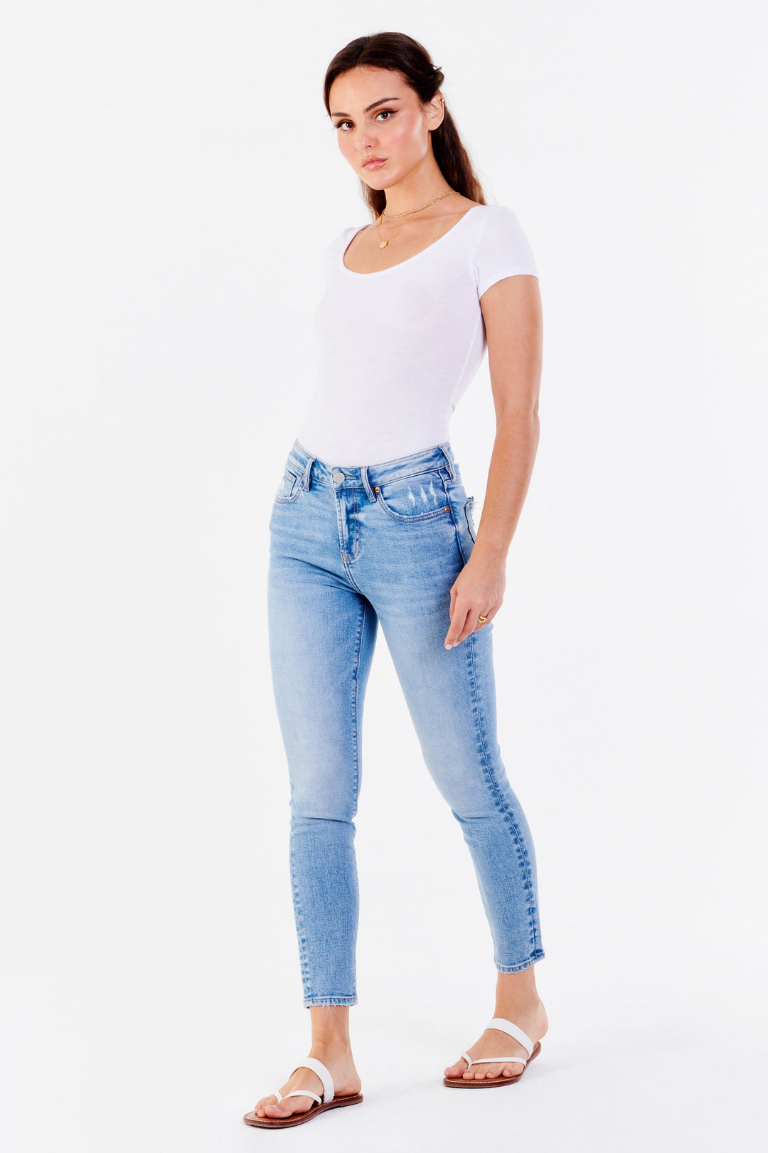 image of a female model wearing a GISELE HIGH RISE ANKLE SKINNY JEANS TURKISH SEA JEANS