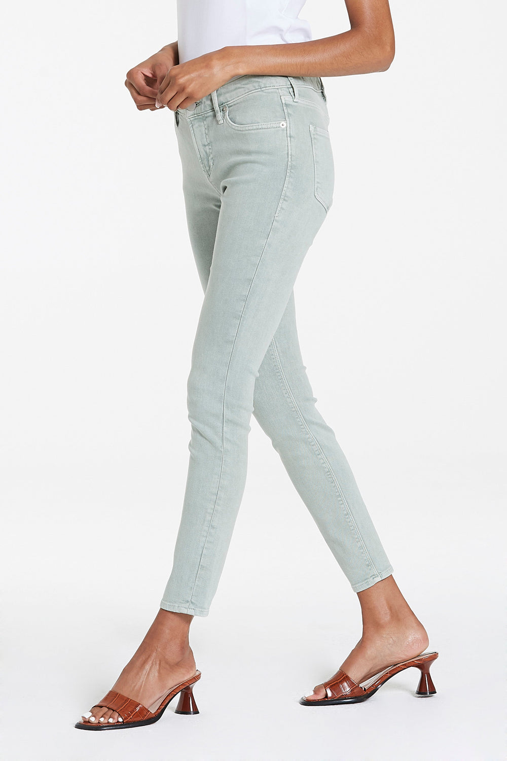 image of a female model wearing a GISELE HIGH RISE ANKLE SKINNY CUCUMBER JEANS JEANS