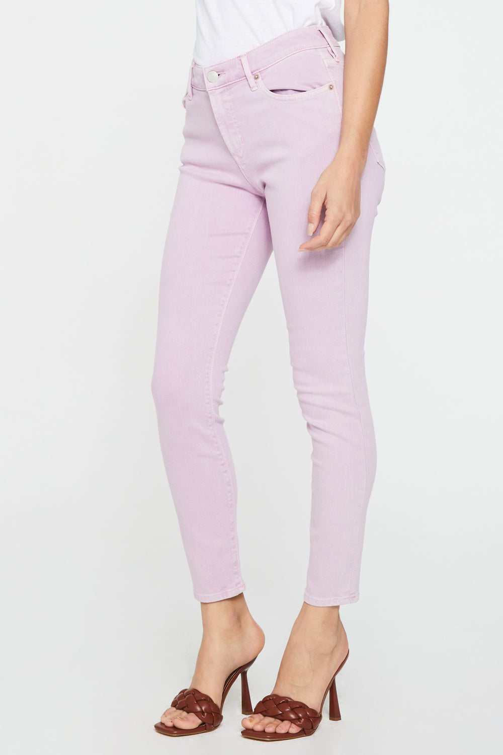 image of a female model wearing a GISELE HIGH RISE ANKLE SKINNY JEANS LAVENDER PINK JEANS