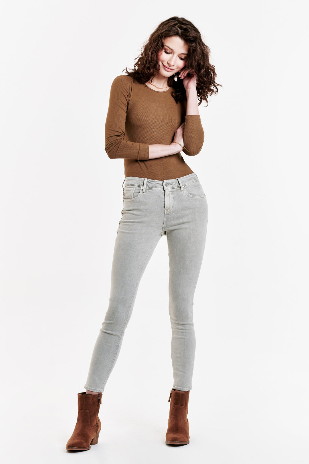 image of a female model wearing a GISELE HIGH RISE ANKLE SKINNY JEANS OYSTER GRAY JEANS