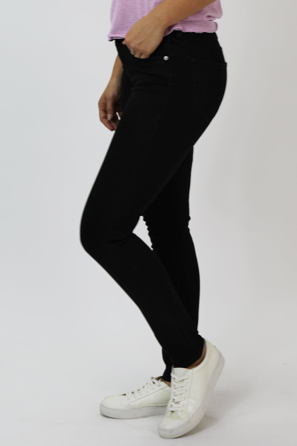 image of a female model wearing a GISELE HIGH RISE SKINNY JEANS BLACK ARROW DEAR JOHN DENIM 