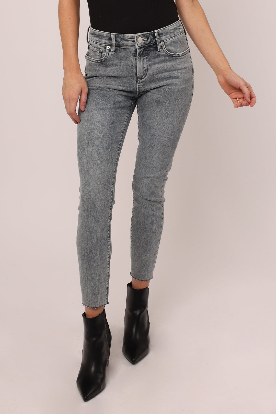 image of a female model wearing a GISELE HIGH RISE ANKLE SKINNY JEANS FAIRFAX JEANS