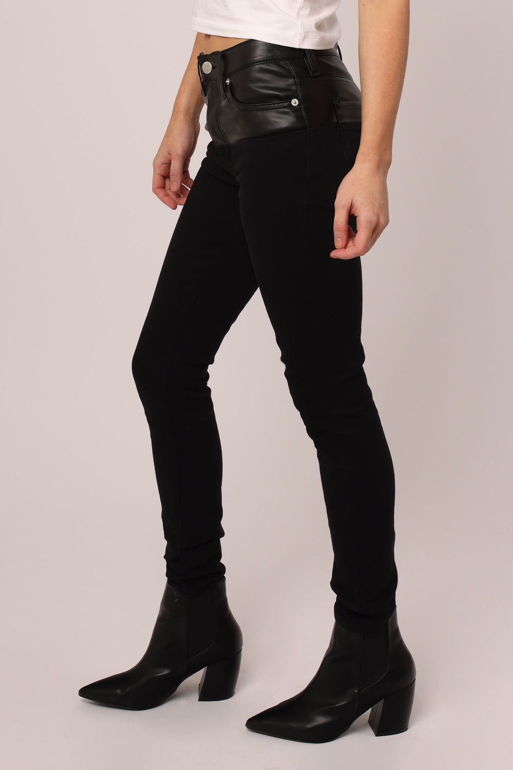 image of a female model wearing a PIXIE HIGH RISE ANKLE SKINNY JEANS BLACK JEANS