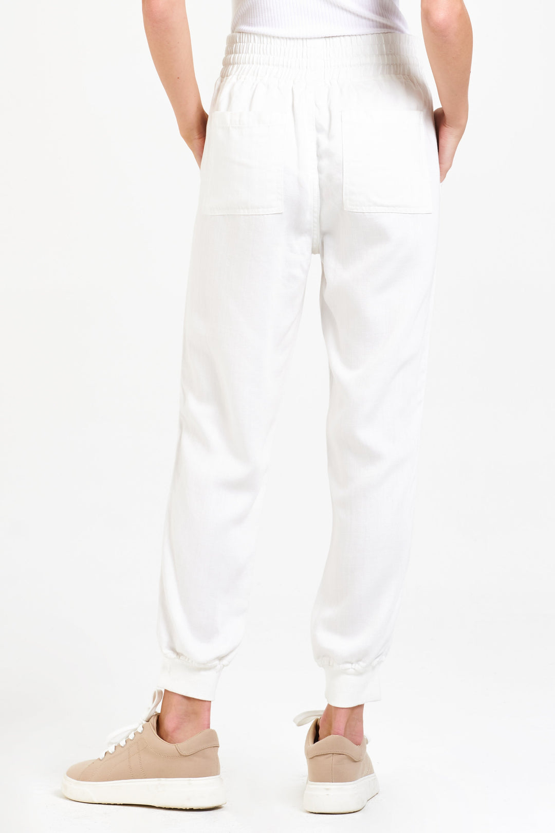 image of a female model wearing a JACEY SUPER HIGHRISE CROPPED JOGGER PANTS OPTIC WHITE DEAR JOHN DENIM 