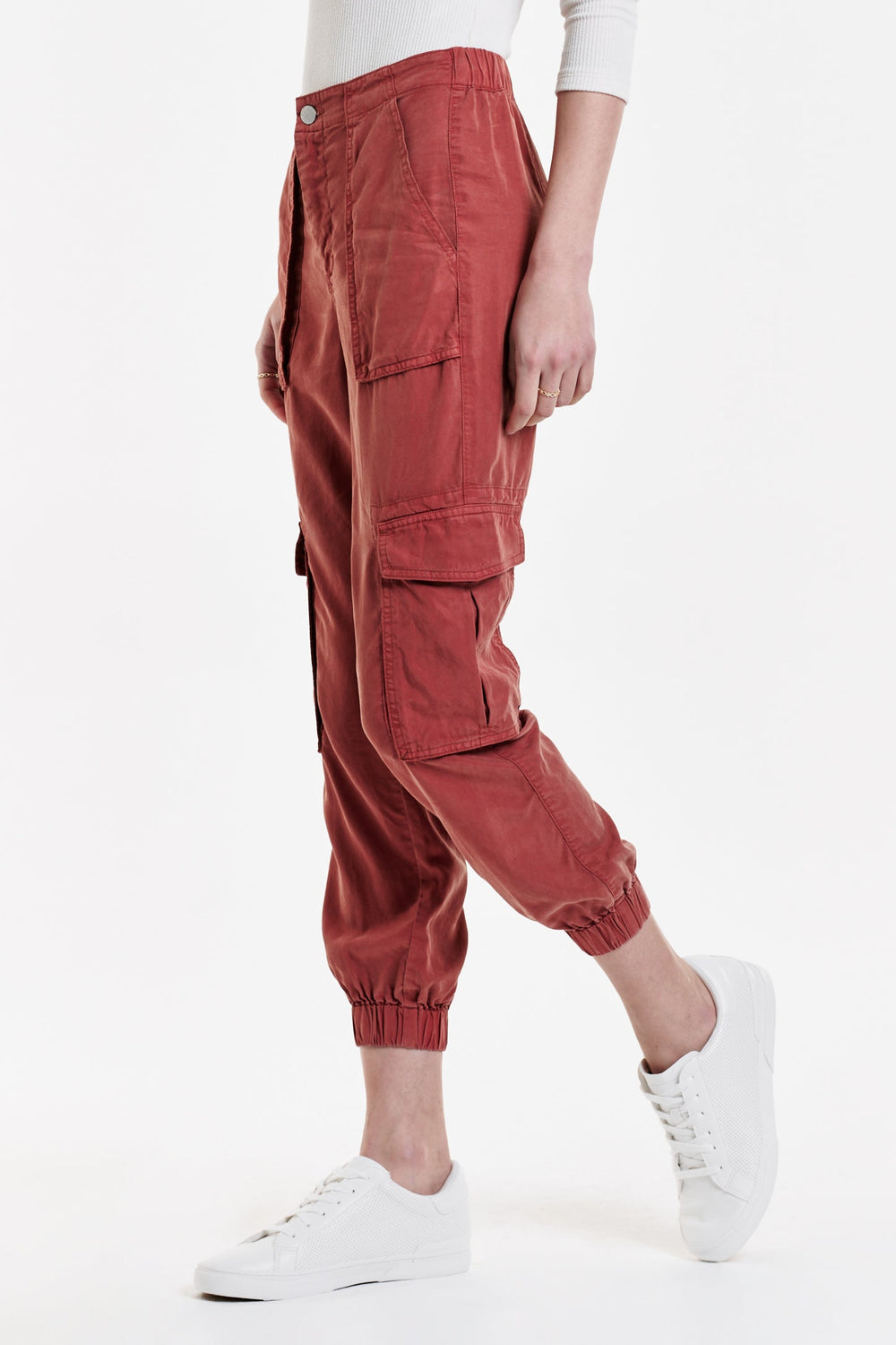 image of a female model wearing a SANDY SUPER HIGH RISE ANKLE TROUSER PANTS POTTERS CLAY DEAR JOHN DENIM 