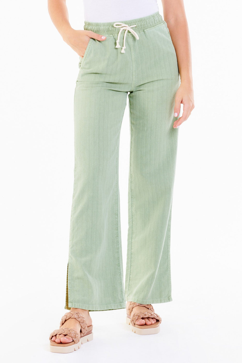 image of a female model wearing a KAYLA HIGH RISE FLARE LEG PANTS LETTUCE DEAR JOHN DENIM 